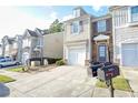 Townhome community view, two-story homes with attached garages at 2158 Executive Dr, Duluth, GA 30096