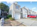Two-story townhome with attached garage and landscaping at 2158 Executive Dr, Duluth, GA 30096