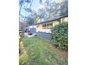 Charming exterior with gray brick accents, white siding, and a manicured lawn at 3109 Cloverhurst Cir, East Point, GA 30344