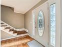 Bright entryway with hardwood floors, staircase, and an oval stained-glass door at 2958 Applewood Ne Ct, Atlanta, GA 30345