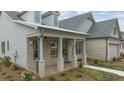 Brick and siding house exterior with a covered porch at 3759 Tielman St, Snellville, GA 30078