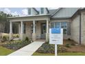 Brick and siding house exterior with a covered porch at 3759 Tielman St, Snellville, GA 30078