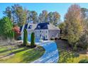 Stunning home with a circular driveway and lush landscaping at 5955 Tibor Nw Dr, Acworth, GA 30101