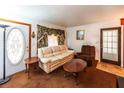Living room with light beige couch and wooden coffee table at 6055 Blackhawk Se Trl, Mableton, GA 30126