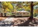 House exterior with landscaping and driveway at 6055 Blackhawk Se Trl, Mableton, GA 30126