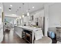 Modern kitchen with white cabinets, a large island, and stainless steel appliances at 223 Britten Pass, Alpharetta, GA 30009