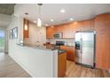 Modern kitchen with stainless steel appliances and wood cabinets at 3300 Windy Ridge Se Pkwy # 1121, Atlanta, GA 30339