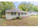 Brick ranch home with a covered porch and nice lawn at 1788 Danrich Dr, Decatur, GA 30032