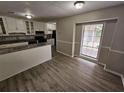 Dining area with view into kitchen and granite counters at 199 Holly Springs Ct, Ellenwood, GA 30294