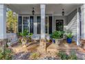 Front porch with stone flooring and potted plants at 1870 Mayfield Rd, Alpharetta, GA 30009