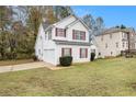 Two-story house with attached garage at 4103 Kingship Dr, Ellenwood, GA 30294