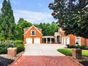 Three-car garage with additional covered parking at 2034 Gold Leaf Pkwy, Canton, GA 30114