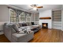 Cozy living room featuring a fireplace, hardwood floors, and large windows at 3766 Citation Dr, Decatur, GA 30034