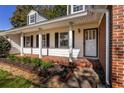 Inviting front porch with brick columns and tiled flooring at 3766 Citation Dr, Decatur, GA 30034