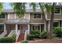 Inviting exterior of charming townhome with brick walkway and lush landscaping at 6 Alston Ne Pl, Atlanta, GA 30324