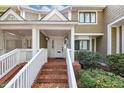 Front entrance of townhome with brick steps and white railing at 6 Alston Ne Pl, Atlanta, GA 30324