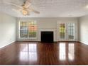 Living room features hardwood floors, fireplace and access to patio at 3781 Harvest Dr, Decatur, GA 30034
