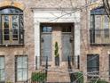 Two townhome entrances with grey doors and brick accents at 53 Honour Nw Ave, Atlanta, GA 30305