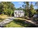 Two story house with attached garage and a detached shop at 364 Whooping Creek Rd, Carrollton, GA 30116