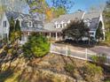 House with white exterior, grey roof, and a long driveway at 220 Spring Branch Dr, Canton, GA 30115