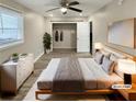 Virtually staged bedroom with large bed and walk-in closet at 1672 Scufflegrit Rd, Marietta, GA 30062