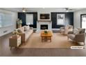 Virtually staged living room with fireplace and neutral decor at 1672 Scufflegrit Rd, Marietta, GA 30062