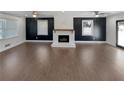 Spacious living room featuring hardwood floors and a fireplace at 1672 Scufflegrit Rd, Marietta, GA 30062