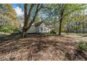 Charming one-story home with white siding, green shutters, and a front porch at 1765 Holly Springs Ne Rd, Marietta, GA 30062