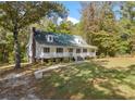 One story house with wrap around porch at 8291 Highway 5, Whitesburg, GA 30185