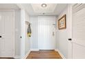 Bright entryway with wood flooring and white door at 2870 Pharr Court South Nw # 1410, Atlanta, GA 30305