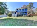 Two story blue house with front yard at 210 Summertown Dr, Stockbridge, GA 30281