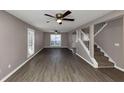 Bright living room with hardwood floors and neutral decor at 214 Kensington Trce, Stockbridge, GA 30281
