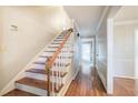 Bright entryway with hardwood floors and a wooden staircase at 2864 Holly Oaks Dr, Marietta, GA 30062