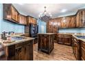 Kitchen with dark wood cabinets and granite counters at 1391 Arbor Hill Ct, Lawrenceville, GA 30045