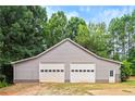 Detached two-car garage with extra storage at 160 Cross Rd, Covington, GA 30016
