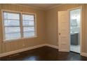 Bedroom with ensuite bathroom and dark hardwood floors at 8424 Taylor Rd, Riverdale, GA 30274