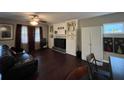 Spacious living room with built-in shelving and hardwood floors at 136 Fawn Dr, Villa Rica, GA 30180