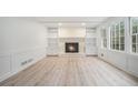 Living room featuring a fireplace and built-in shelving at 2615 Kinnett Sw Dr, Lilburn, GA 30047