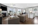 Spacious living area with open kitchen and island at 386 Village Ln, Fairburn, GA 30213