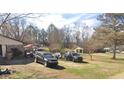 Home with large backyard, and a detached garage at 4706 Piney Grove Rd, Cumming, GA 30040