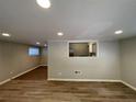 Open living area with hardwood floors and kitchen pass-through at 1885 Broad Ave, East Point, GA 30344