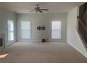 Spacious living room with fireplace and neutral colors at 2118 Water Mill Ct, Buford, GA 30519