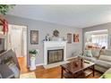 Bright living room featuring hardwood floors and a fireplace at 1778 Campbellton Sw Rd, Atlanta, GA 30311