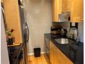 Well-equipped galley kitchen with stainless steel appliances at 98 De Arc Nw, Atlanta, GA 30327