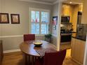 Bright dining area with wood floors and view into kitchen at 98 De Arc Nw, Atlanta, GA 30327