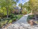 Beautiful home exterior featuring a brick facade and manicured landscaping at 7300 Chattahoochee Bluff Dr, Atlanta, GA 30350