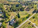 Aerial view showing home, pool, and large lot near a road at 4409 Shiloh Rd, Loganville, GA 30052