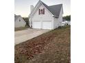 Two-story house with two-car garage and landscaped lawn at 137 St Ann Cir, Dallas, GA 30157