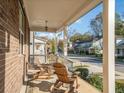 Covered porch overlooking the neighborhood at 962 Rittenhouse Way, Atlanta, GA 30316