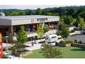 Reformation Brewery, with outdoor seating and a vintage trailer at 172 Railroad St, Canton, GA 30114